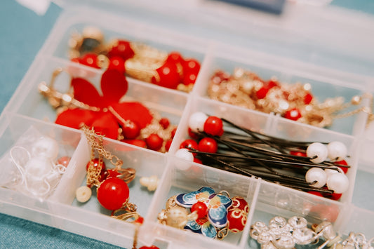 red and white plastic beads on white plastic container