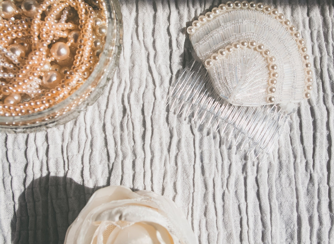 2 white ceramic floral bowls on white textile