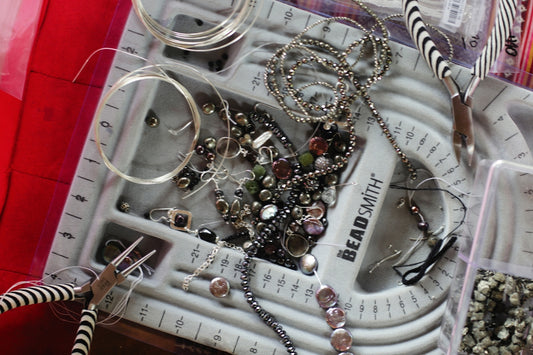 a collection of jewelry sitting on top of a table