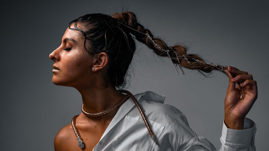 a woman with her hair blowing in the wind