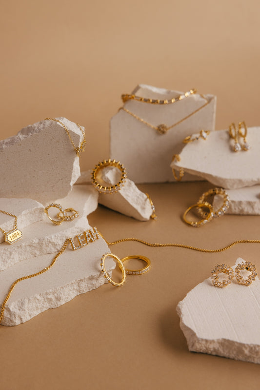 a bunch of jewelry sitting on top of a table