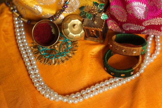 a close up of a necklace on a table