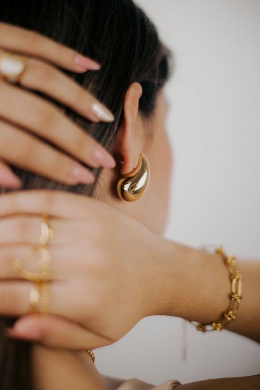 a woman with two rings around her neck
