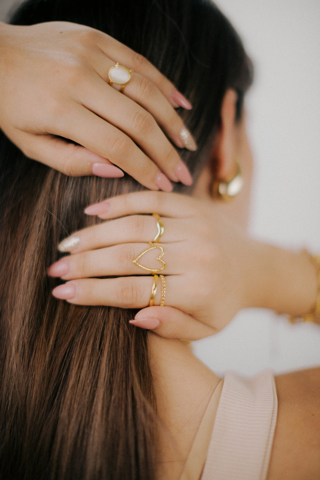 a woman with her hands on her hair
