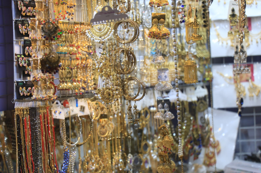 A store with lots of gold jewelry hanging from it's walls