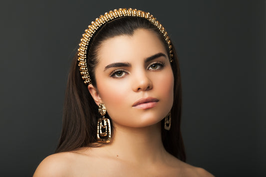 A woman with long hair wearing a head piece