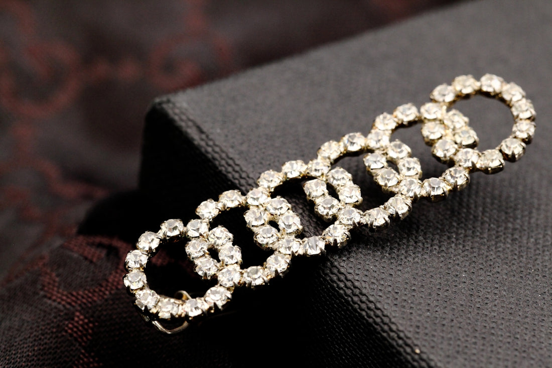 A close up of a brooch on a piece of cloth